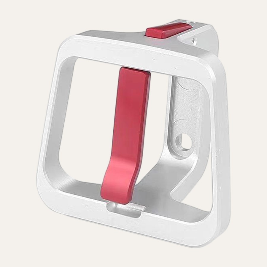 Silver carrier block with red lever